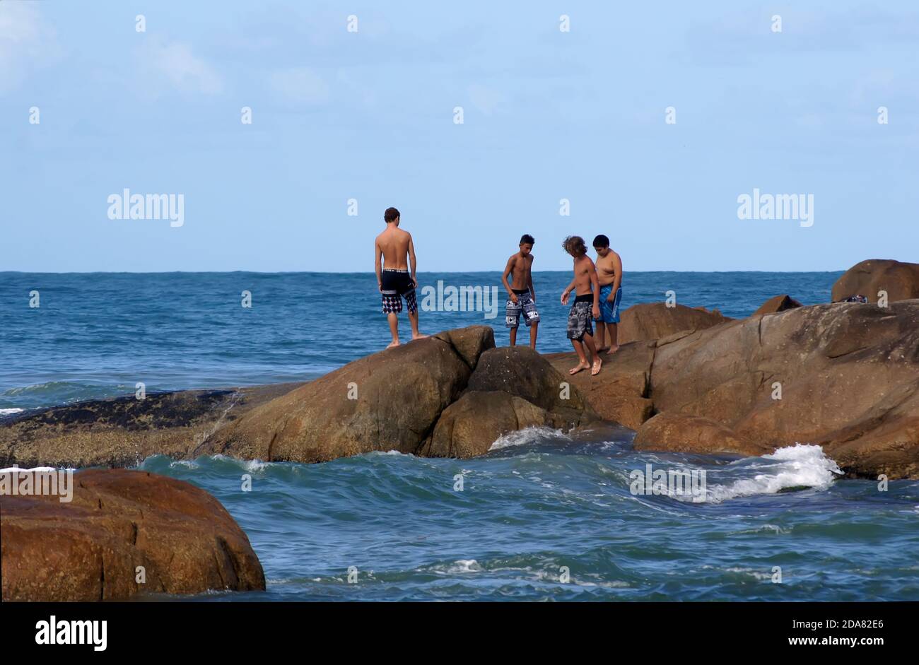 Tourists and surfers at Praia do Rosa in Imbituba, Santa Catarina Brazil - June 13, 2016. Stock Photo