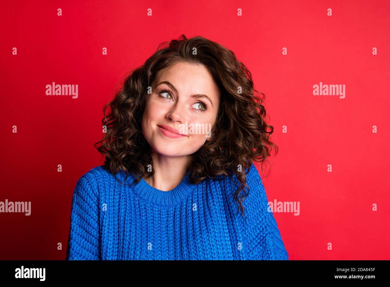 Photo of cute lovely lady curly hairdo childish look empty space thinking planning idea ponderous minded wear blue knitted sweater pullover isolated Stock Photo