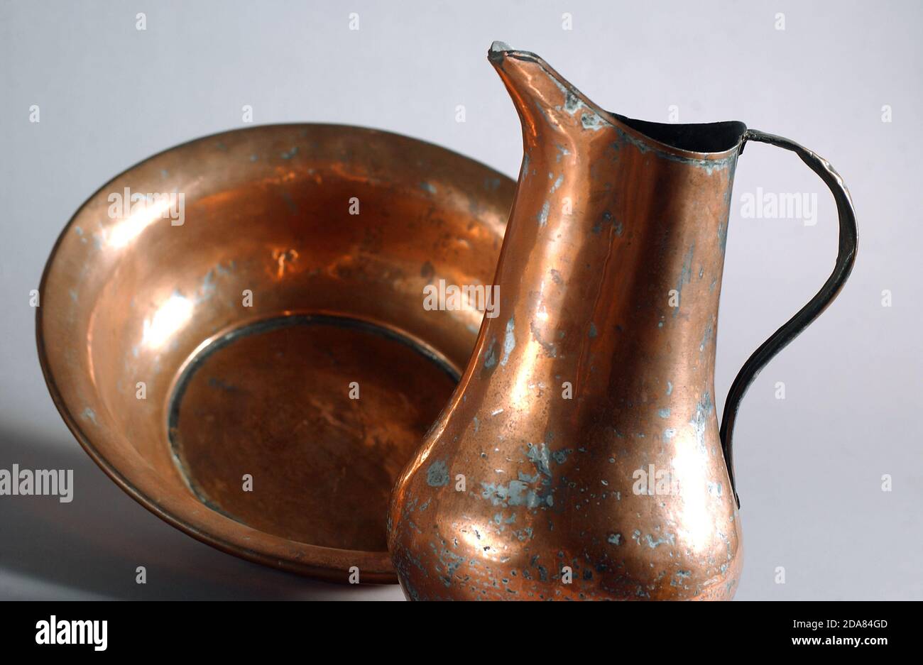 Antique set of copper jugs and basins for personal hygiene Stock Photo