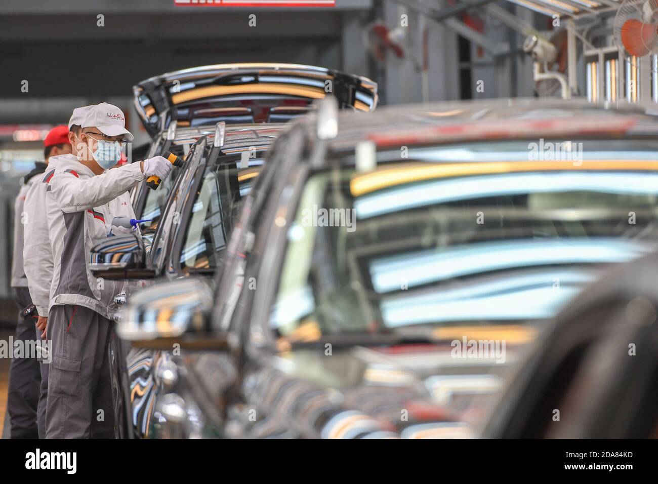 Changchun, China's Jilin Province. 23rd Sep, 2020. Workers check vehicles at the general assembly line of Hongqi, the leading sedan brand of First Automotive Works (FAW) Group Co. Ltd., in Changchun, northeast China's Jilin Province, Sept. 23, 2020. First Automotive Works (FAW) Group Co. Ltd., China's leading automaker, sold more than 3.01 million vehicles in the first 10 months of this year, an increase of 7.8 percent year on year, the company said. Credit: Zhang Nan/Xinhua/Alamy Live News Stock Photo