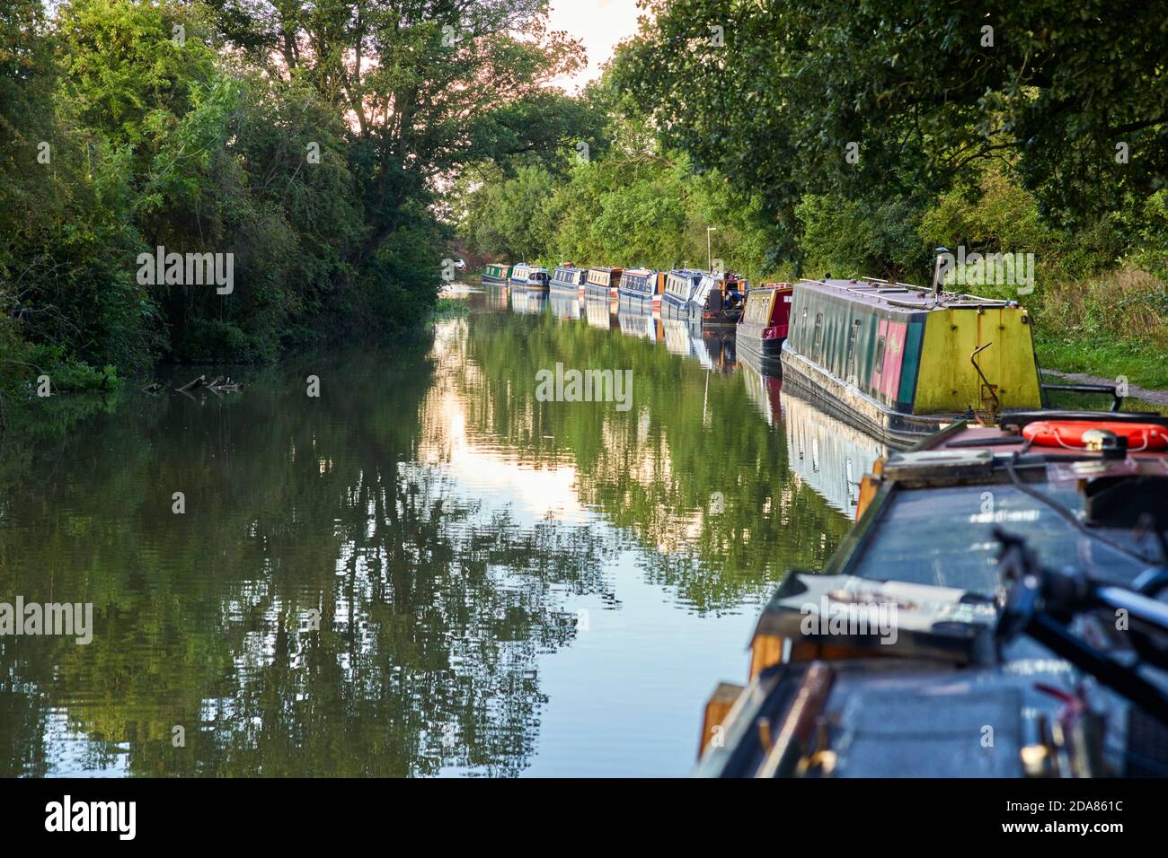 A line of narrowboats moored up for the night just outside of Braunston on the Grand Union Canal Stock Photo