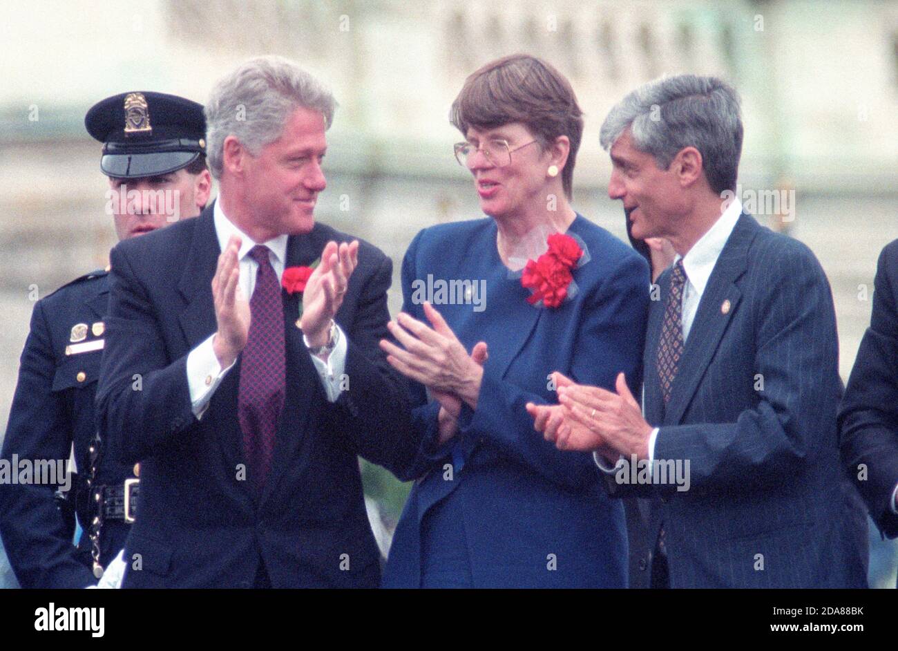 United States President Bill Clinton, left, with US Attorney General Janet Reno, center, and Us Secretary of Treasury Robert Rubin at the United States Capitol during the 15th Annual National Peace Officers Memorial Day Service in Washington, DC on May 15, 1996.  Photo by Francis Specker Stock Photo