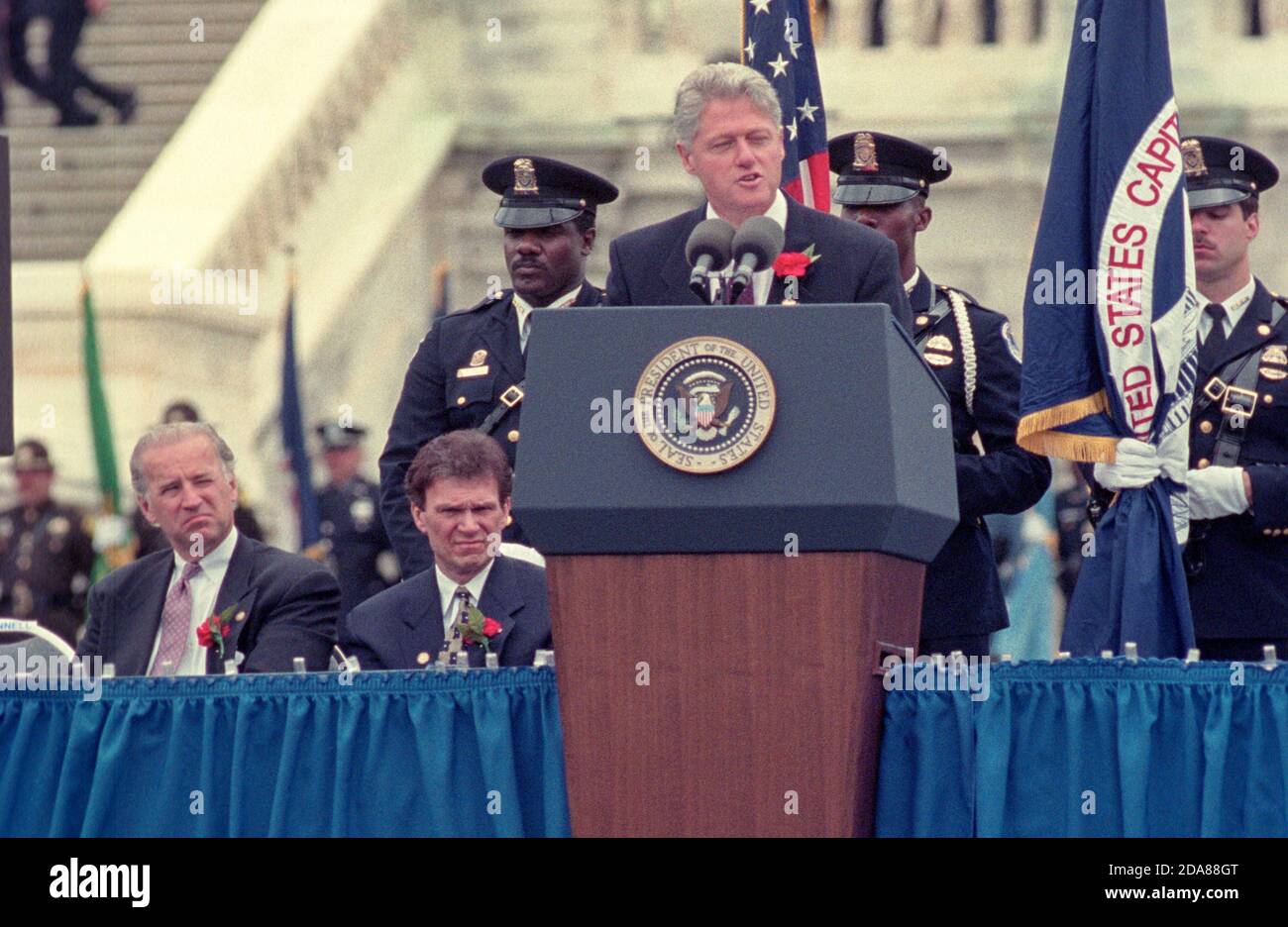 United States President Bill Clinton at the United States Capitol during the 15th Annual National Peace Officers Memorial Day Service in Washington, DC on May 15, 1996. Also shown is US Senator Joe Biden, left, and US Senator Tom Daschle.  Photo by Francis Specker Stock Photo