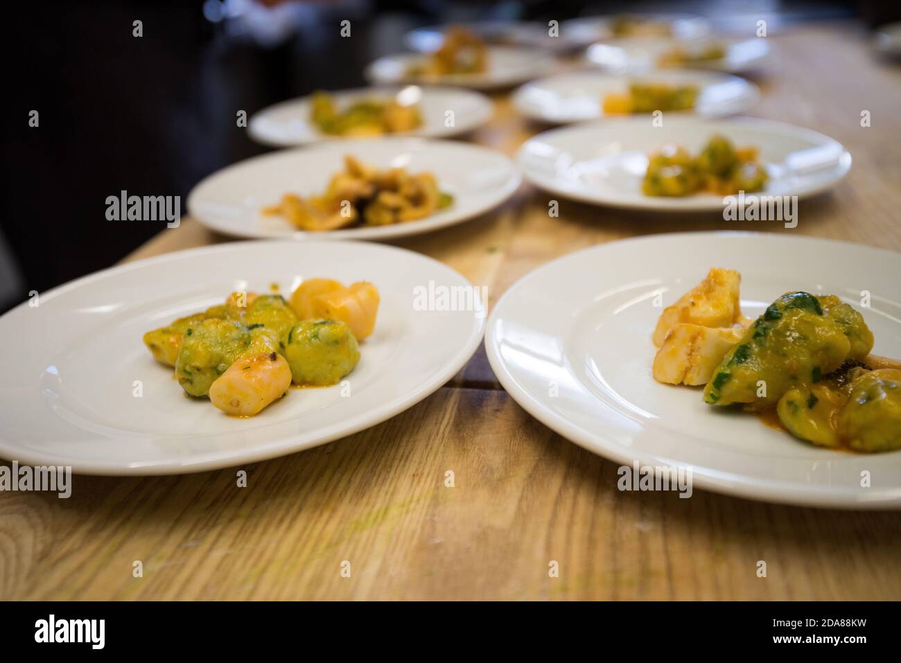 Homemade gnocchi with ramson on small plates as starter dish Stock Photo