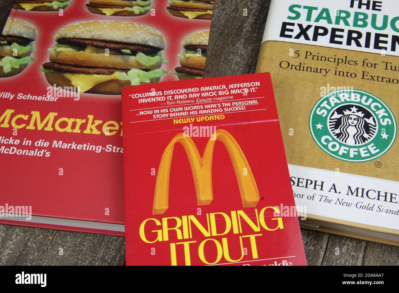 Viersen, Germany - May 1. 2020: Closeup of books about trademarks Mcdonalds and Starbucks franchise business Stock Photo