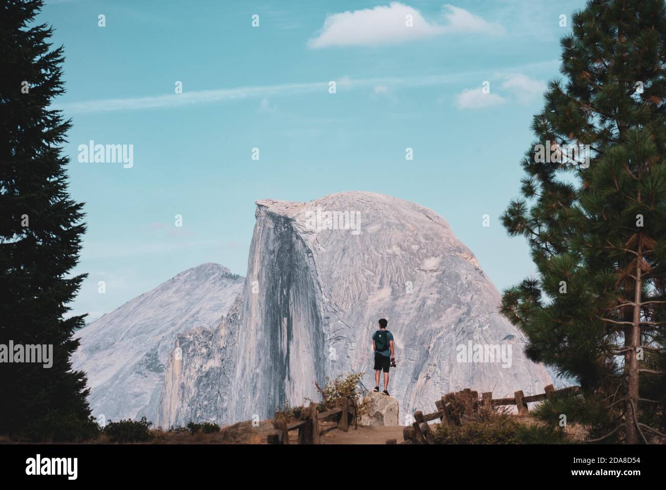 I shot this of my brother gazing at the majestic Half Dome, in Yosemite National Park. We love visiting national parks, all across America. Stock Photo