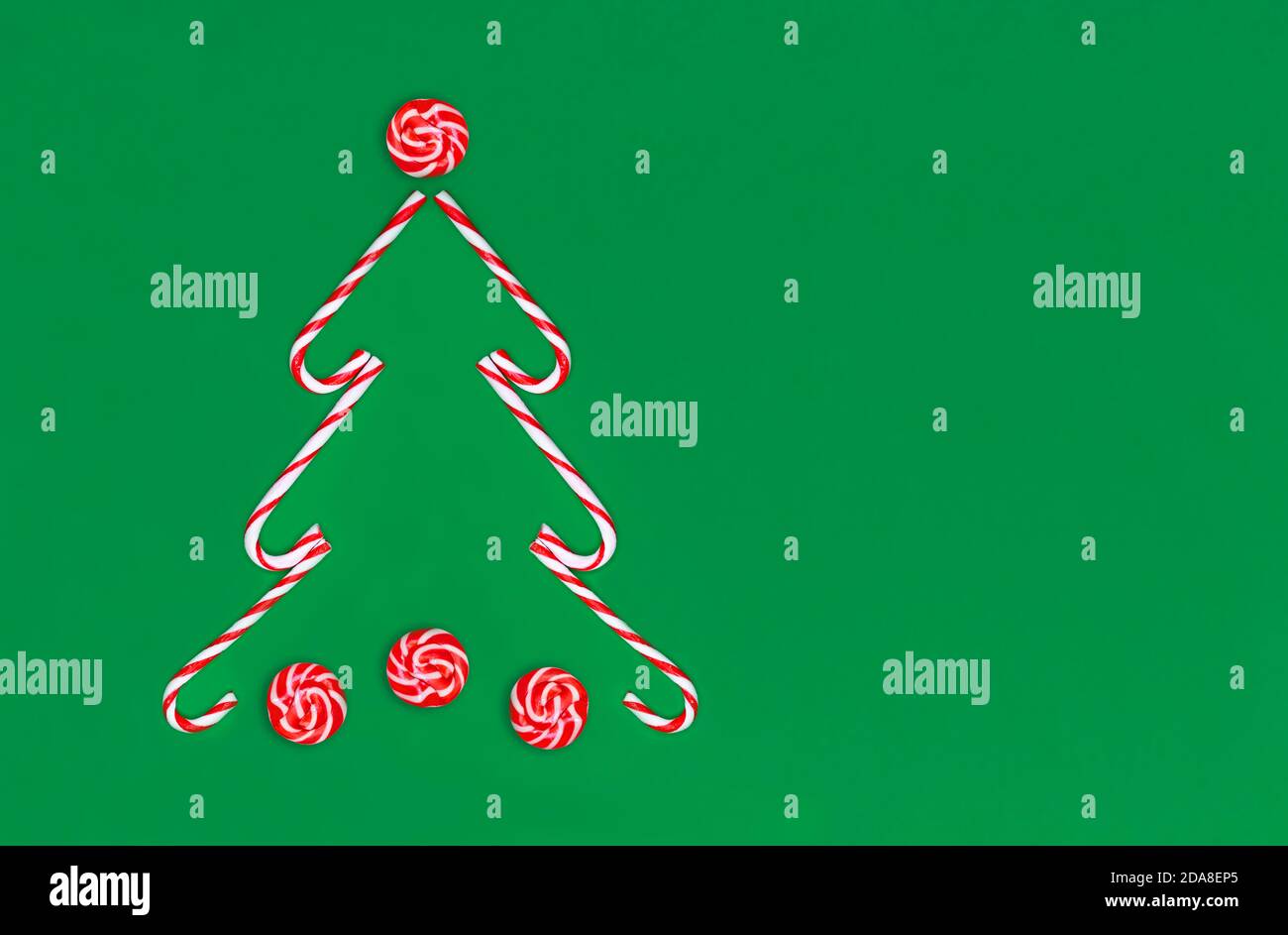 Christmas tree made of candy canes and striped red and white caramel on ...