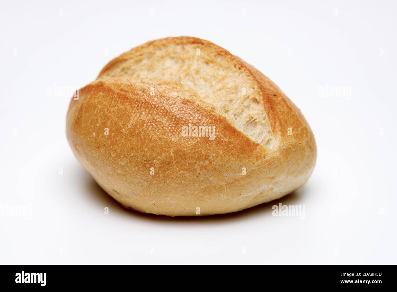 A fresh browned bun on white isolated background, this is a typical