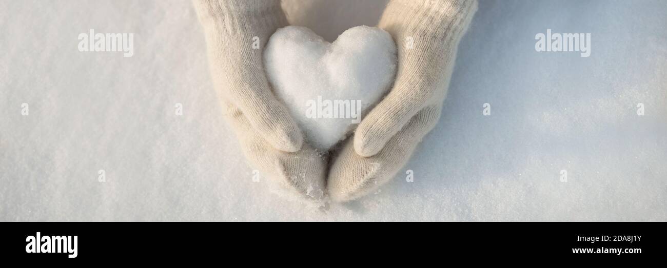 Download Snow Heart In Hands Human Hands In Warm Beige Gloves With Snowy Heart Against Snow Background I Love Winter Or St Valentine S Day Romantic Creative Concept Panorama Banner With Free Space For Text