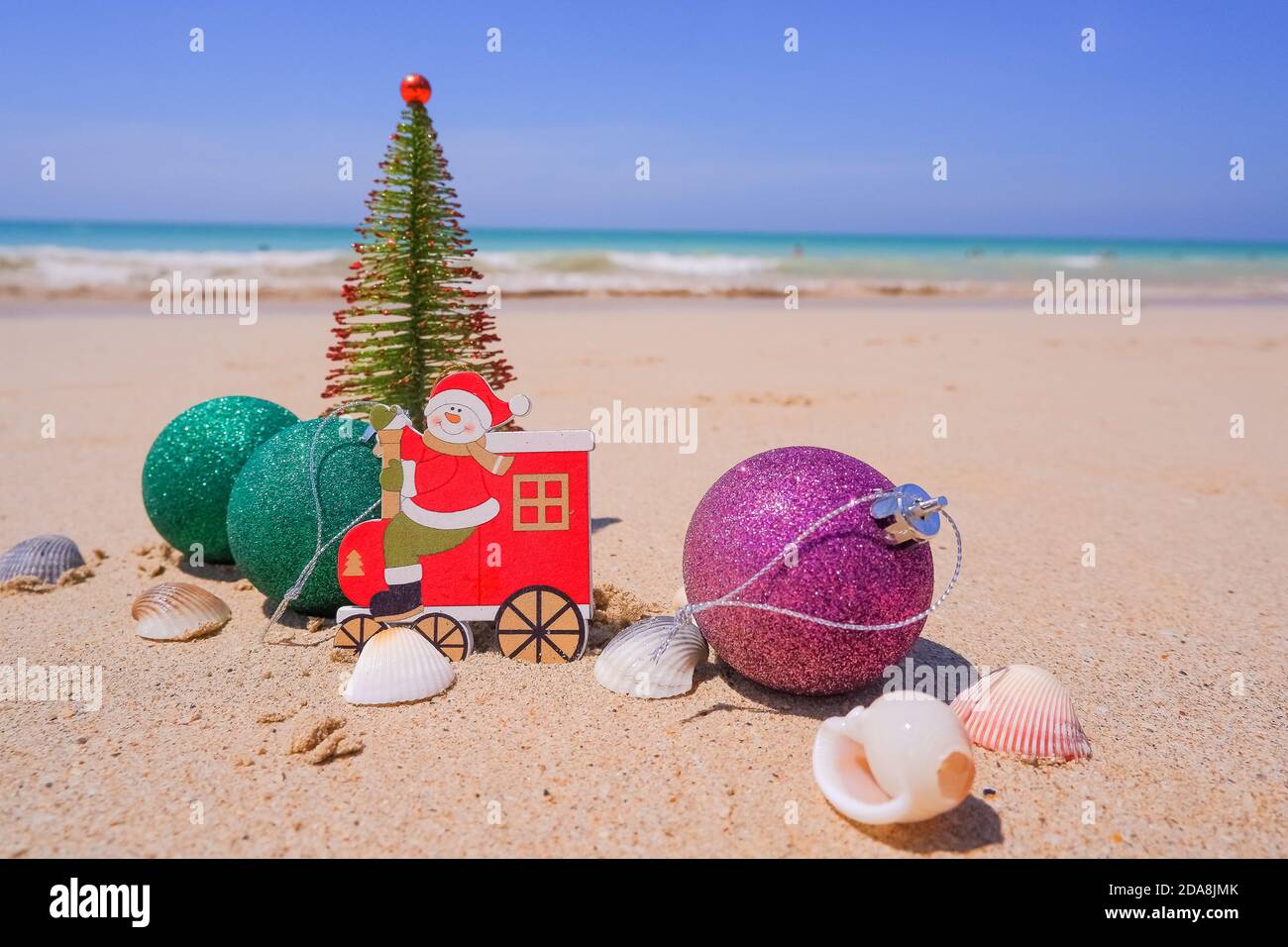 Christmas tree decorations on the beach in tropical. Concept of new year holiday in hot countries Stock Photo