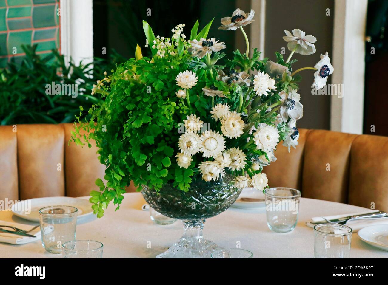elegant dining table set with flower bouquet Stock Photo