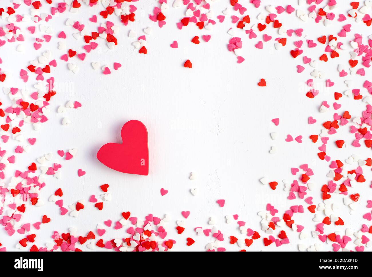 Frame of small hearts and a large heart on a light background Stock Photo -  Alamy