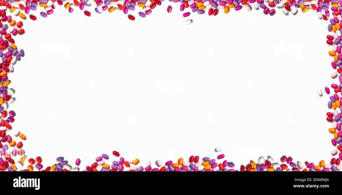 Frame Pill round frame of multicolored pills on a white background. colored pills ...