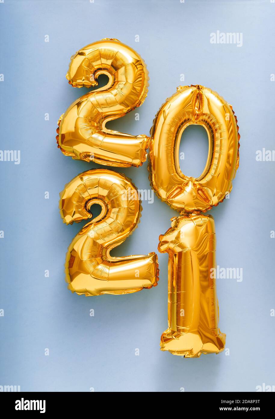 2021 air balloon gold text on violet background. Happy New year eve invitation with Christmas gold foil balloons 2021. Vertical Stock Photo