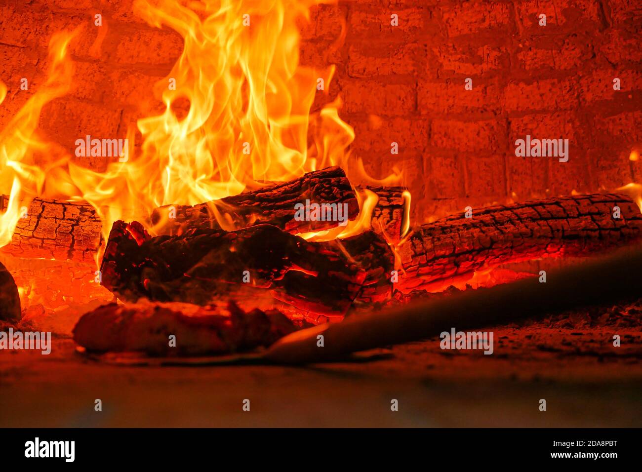 Fire logs burning in flames inside hearth Stock Photo Alamy