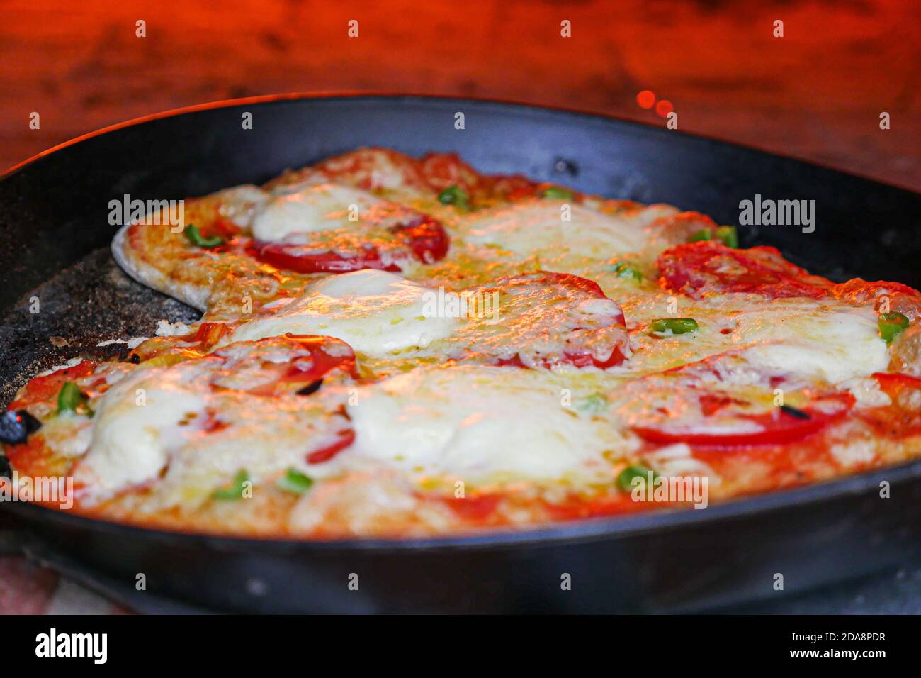 Homemade pizza cooking in metal pan. Close up Stock Photo Alamy