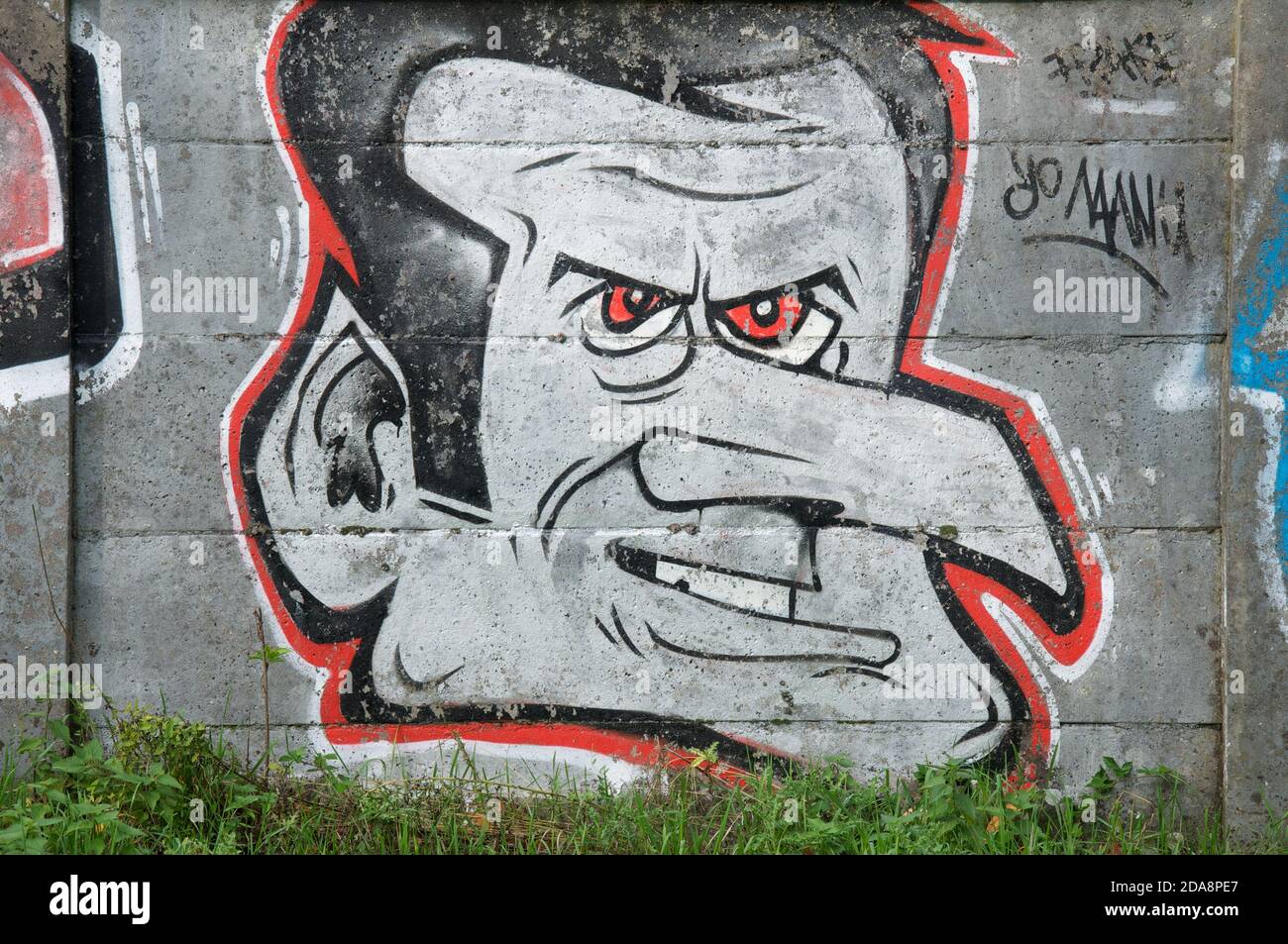 “Yo Manu”. Spray painted graffiti caricature mocking French President Emmanuel Macron. Daubed on a wall in Montlhery, Essonne, France. Stock Photo