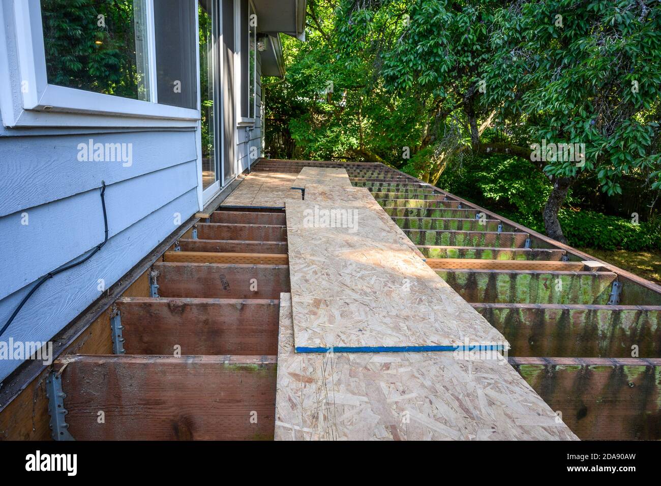 Summer construction, outdoor deck under construction, old support