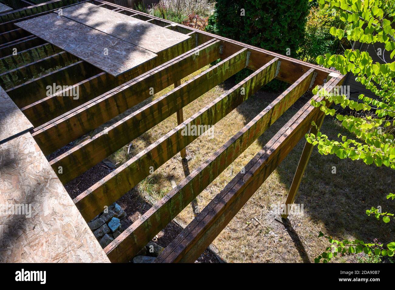 Summer construction, outdoor deck under construction, old support