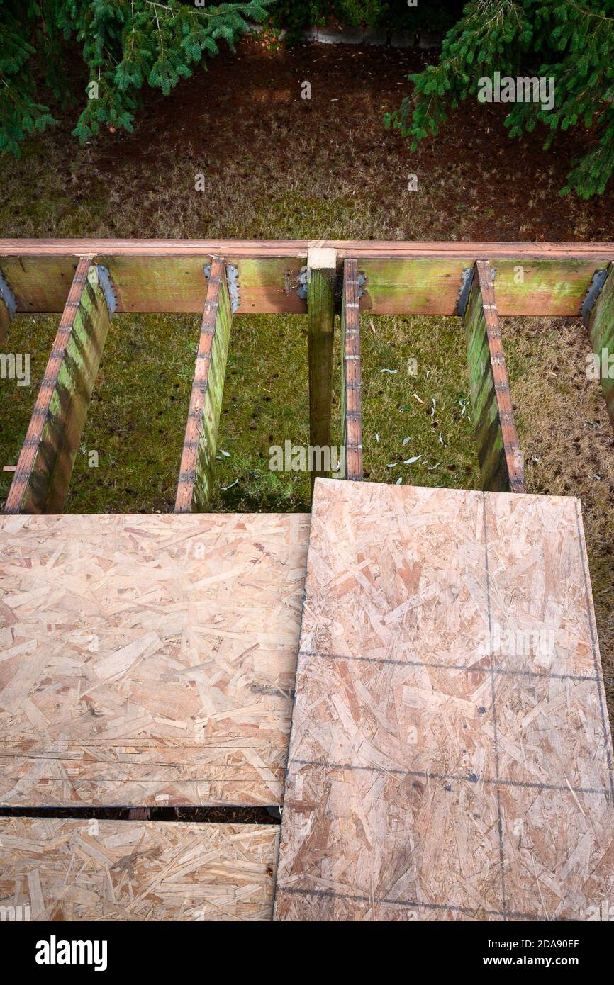 Summer construction, outdoor deck under construction, old support