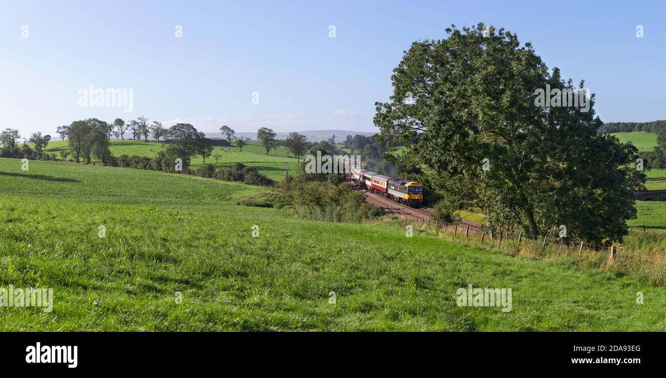 Locomotive services class 47 locomotive 47712 Lady Diana Spencer passing Coniston Cold, Yorkshire with the 'Staycation Express' tourist train Stock Photo