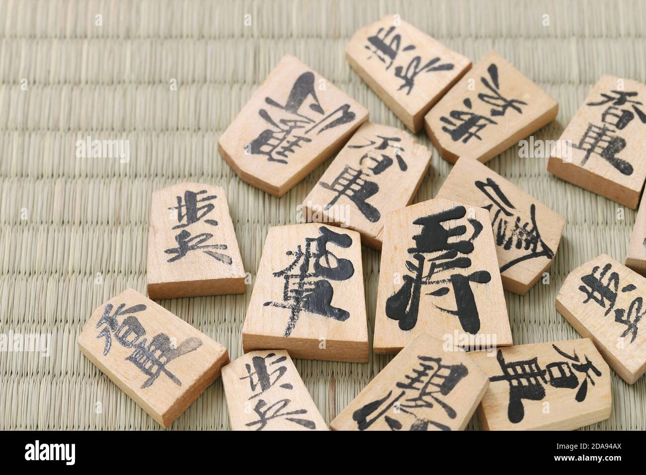 Japanese Shogi pieces on a Tatami background, Shogi is Japanese chess. Word that is written in the piece is king. Stock Photo