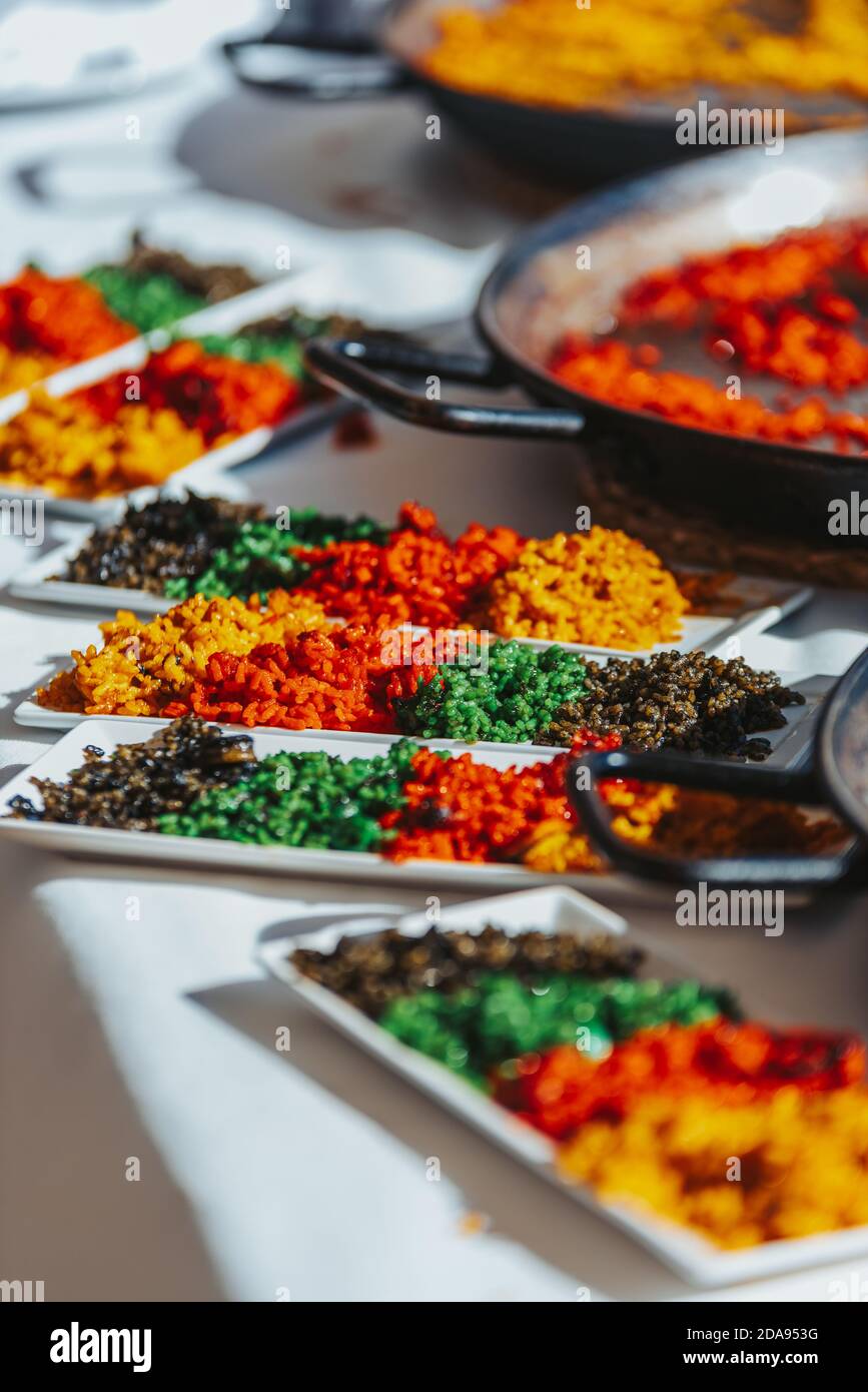 Sample and tasting of various types of Valencian paellas, a traditional