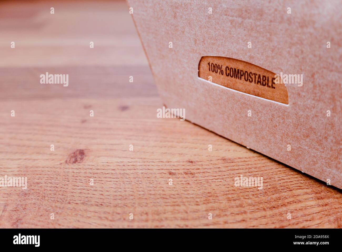 Compostable cardboard box of precooked food with remains, ready to