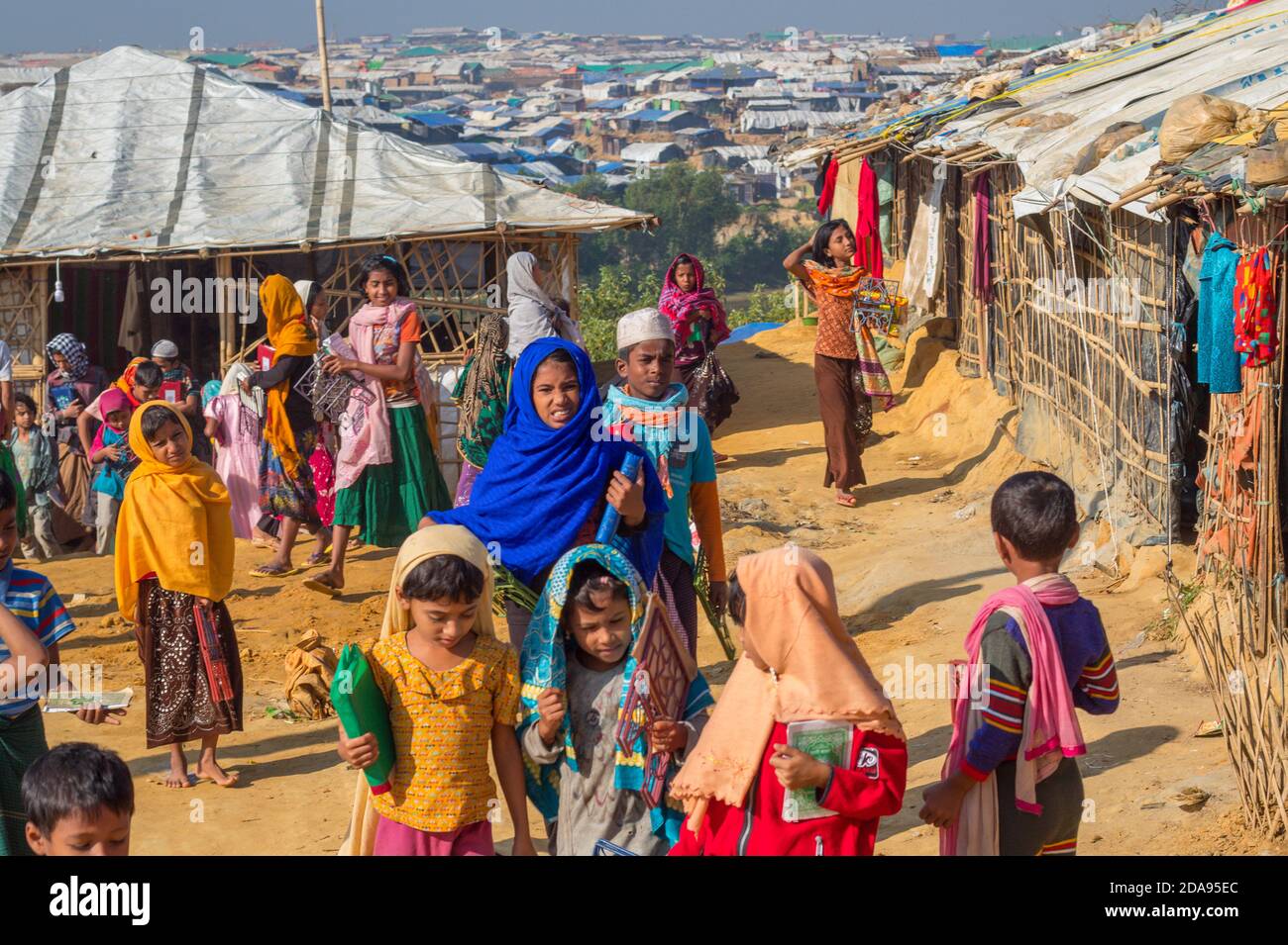 Kids coming out of a faith-based (religious) school in Kutupalong Rohingya camp in Coxs Bazar, Bangladesh. The photo was taken in November 2017 Stock Photo