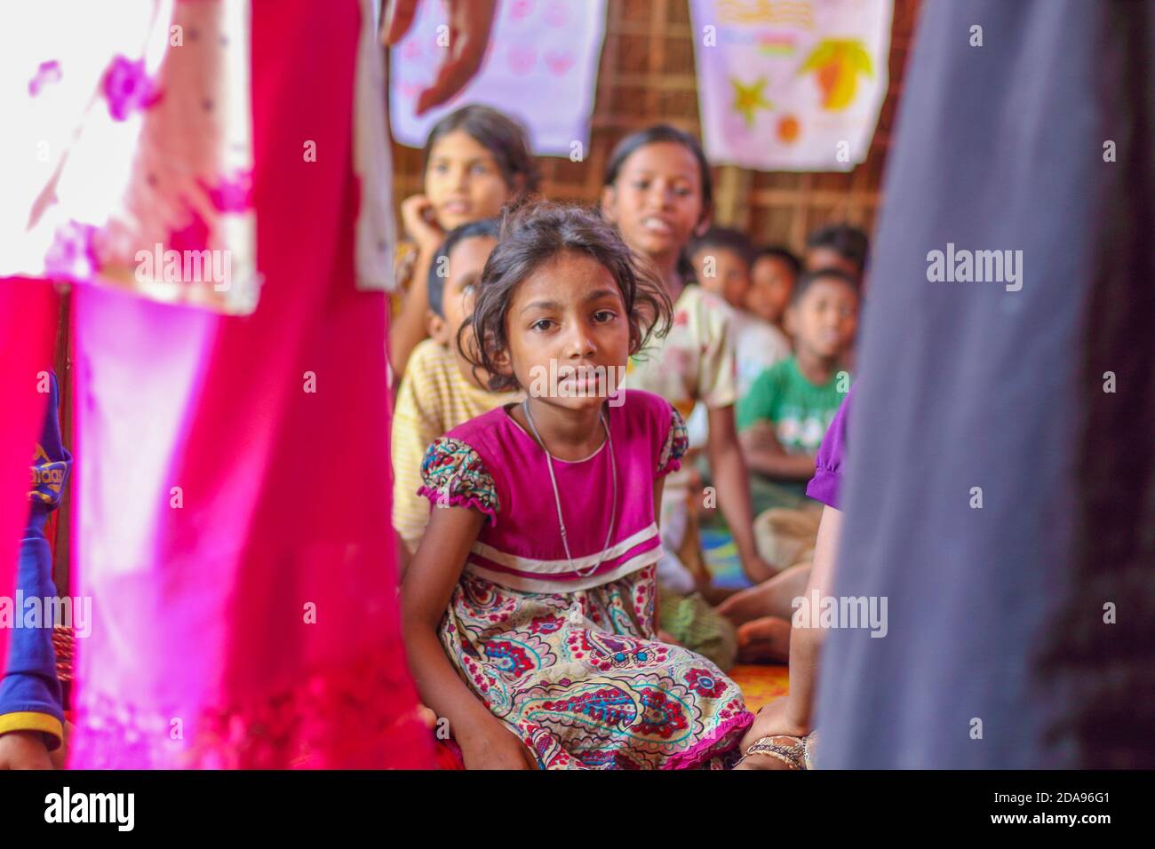 COX'S BAZAR, BANGLADESH - NOVEMBER 25, 2017: A girl Rohingya Muslims refugee child at the camp learning center. Stock Photo