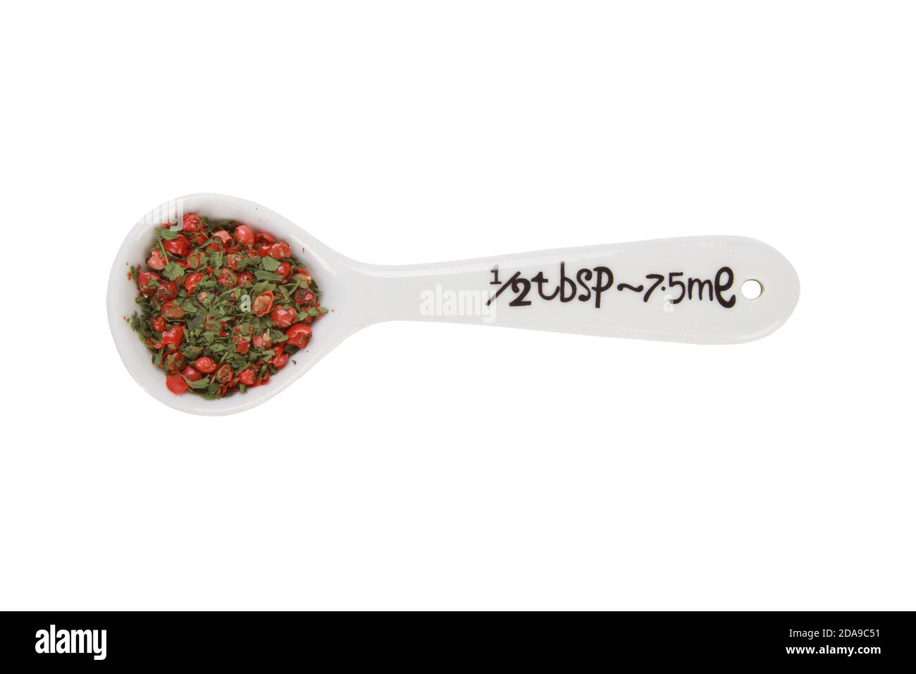 Closeup shot of half tables spoon of pepper isolated on white background Stock Photo
