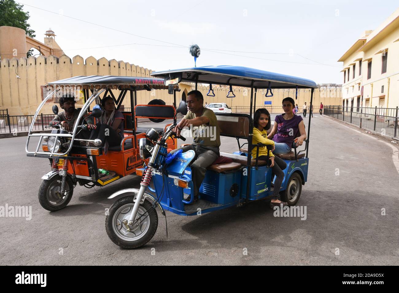 Tourists in Jaipur city during Tuk-Tuk safari on the busy Indian roads on Rajasthan, North India. Stock Photo