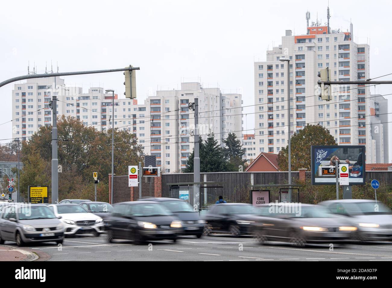 Bremen, Germany. 09th Nov, 2020. Cars drive past the high-rise buildings in the Bremen district of Tenever. In Bremen, the frequent corona infections mainly affect poorer districts. Credit: Sina Schuldt/dpa/Alamy Live News Stock Photo