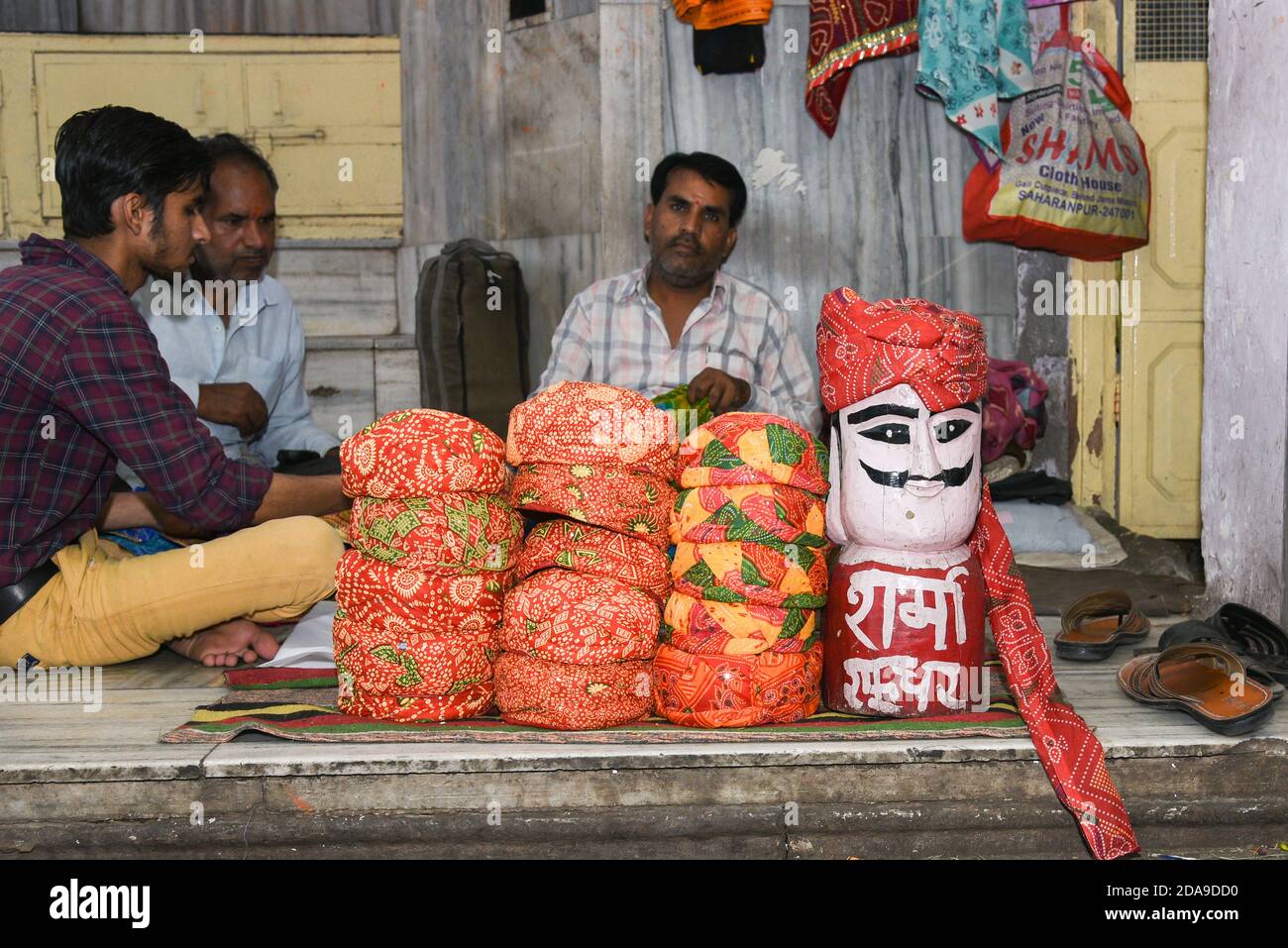 Indian man selling cotton Rajasthani Pagdi , Wedding Turban, Safas