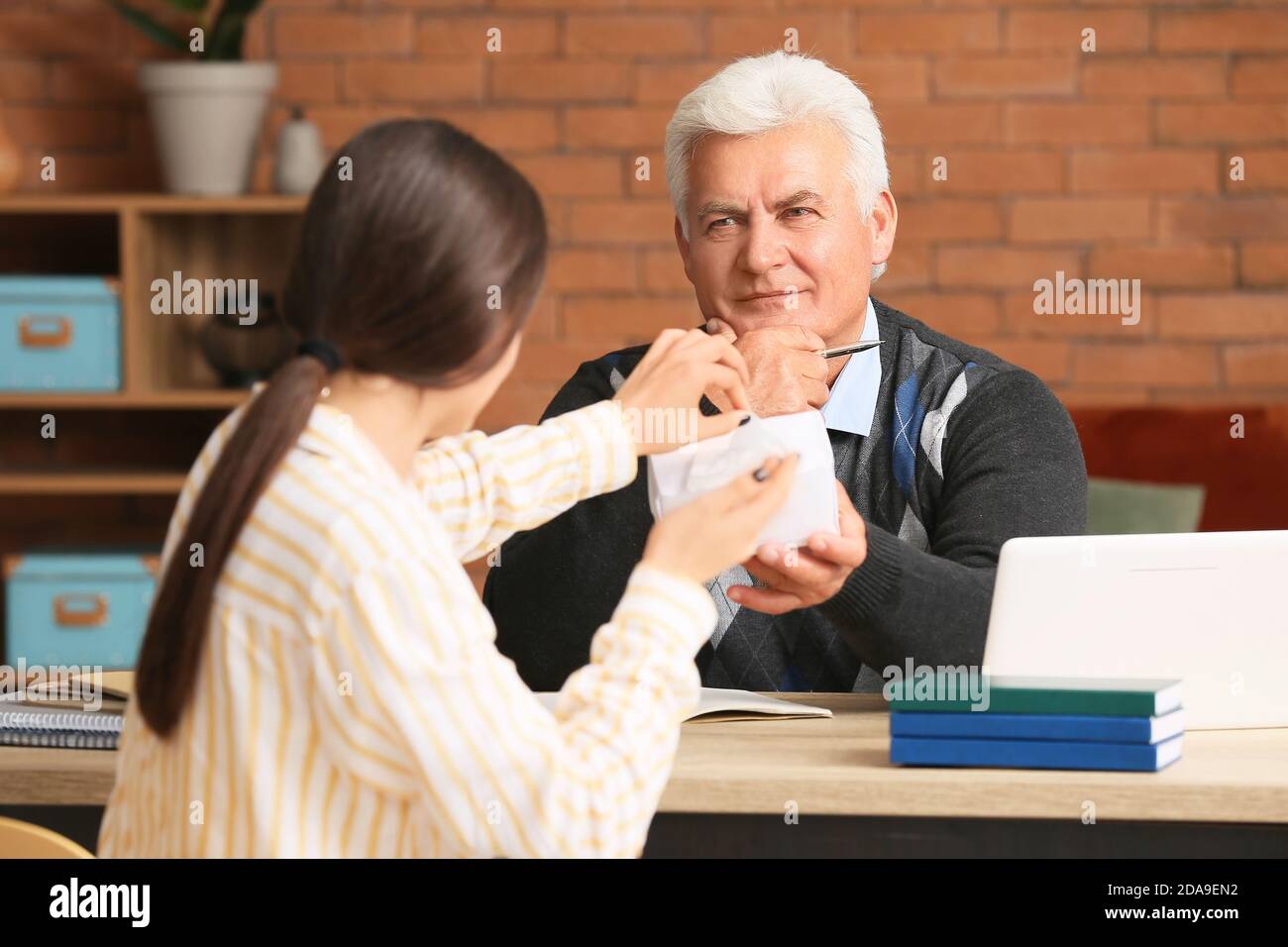 Senior male psychologist working with patient in office Stock Photo Alamy