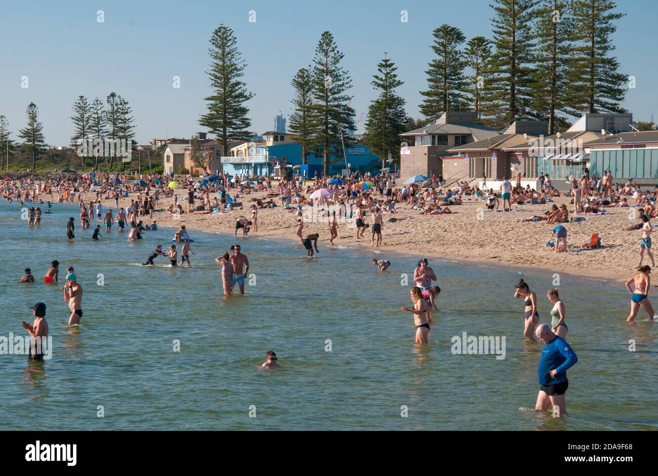 Residents crowd onto Elwood Beach on the first hot day after the lifting of strict COViD-19 lockdown restrictions in Melbourne, Victoria, Australia Stock Photo