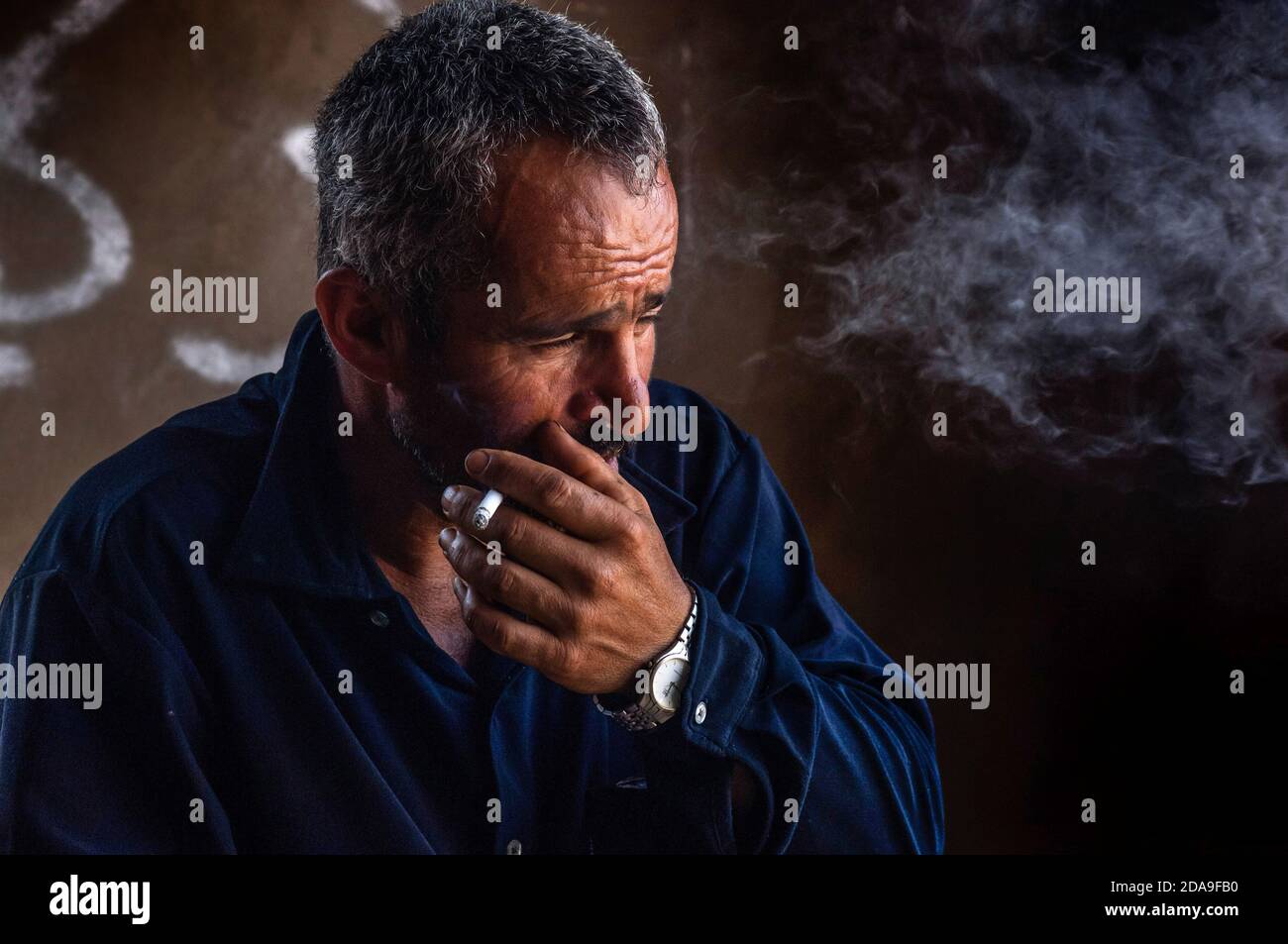 A Lebanese farmer smoking cigarette.Tobacco farming is a primary source