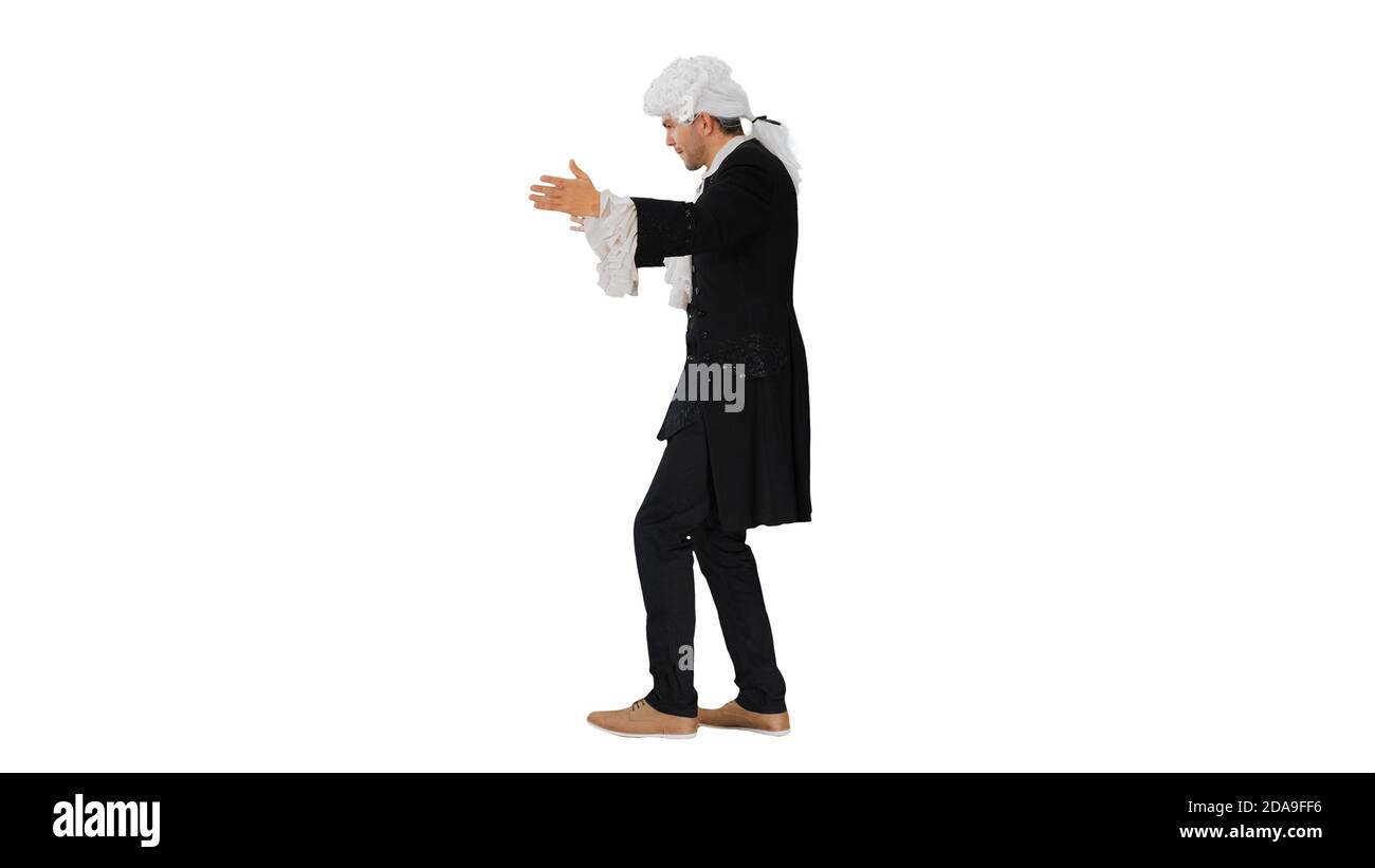 Man dressed like Wolfgang Amadeus Mozart conducting an orchestra Stock Photo