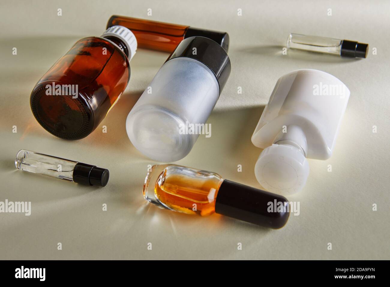 Variety of blanks for hand cream, perfumery, shower gel, bottles without labels on a white background with shadows. Stock Photo