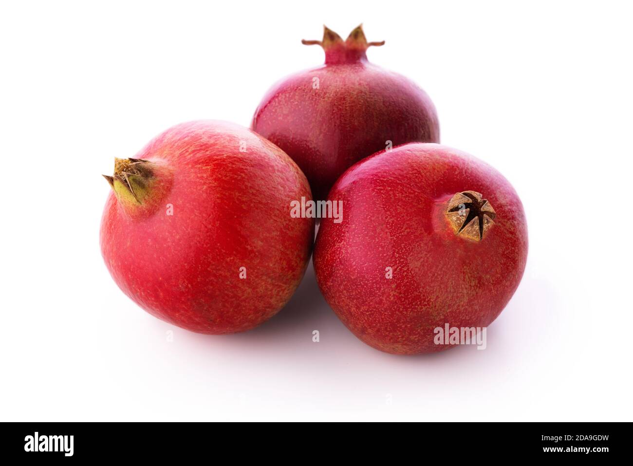 Ripe pomegranate fruits isolated on white background Stock Photo