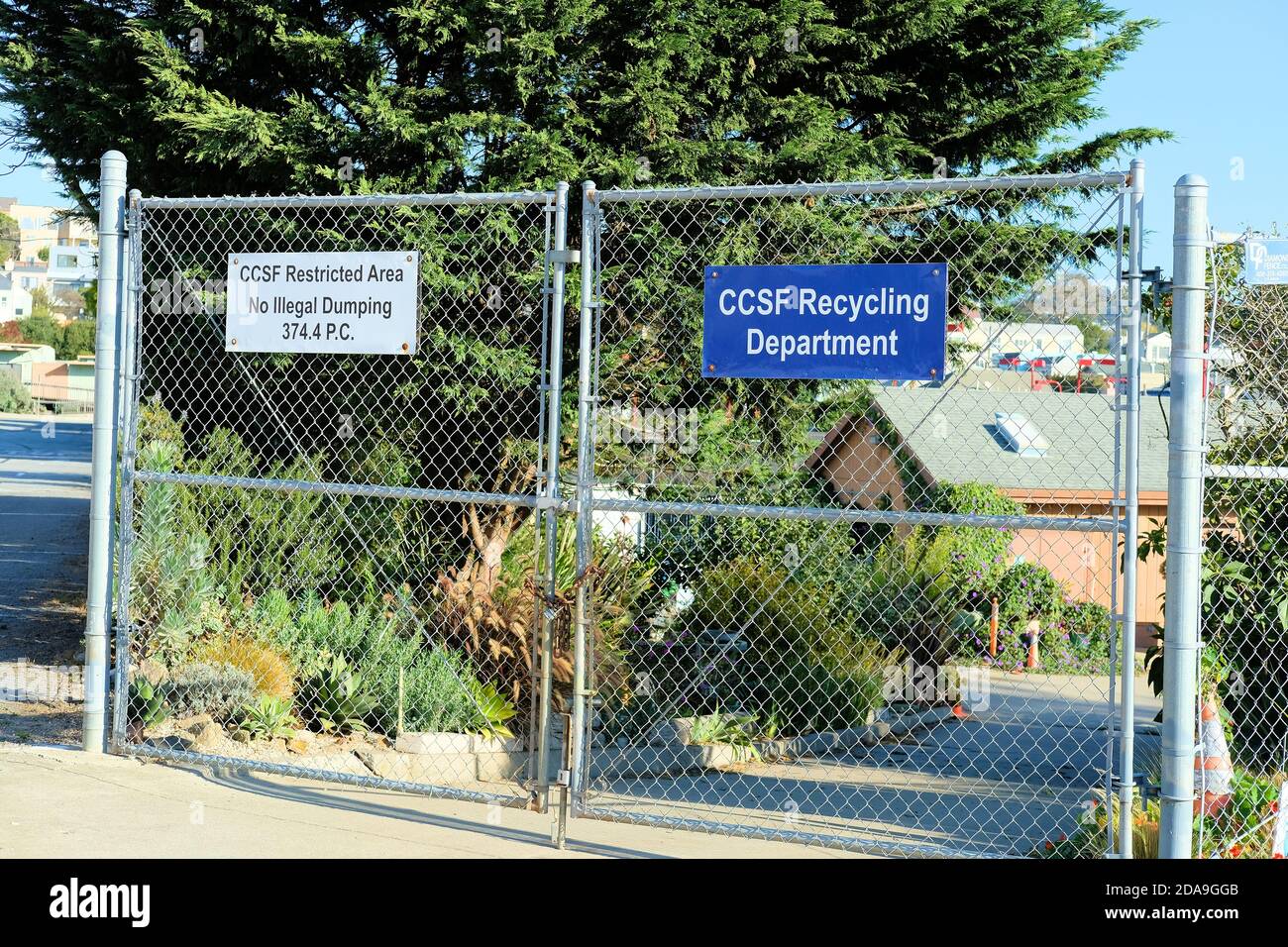 Sign at the closed chain link gate of the City College of San Francisco Recycling Department, Ocean City campus in San Francisco, California. Stock Photo
