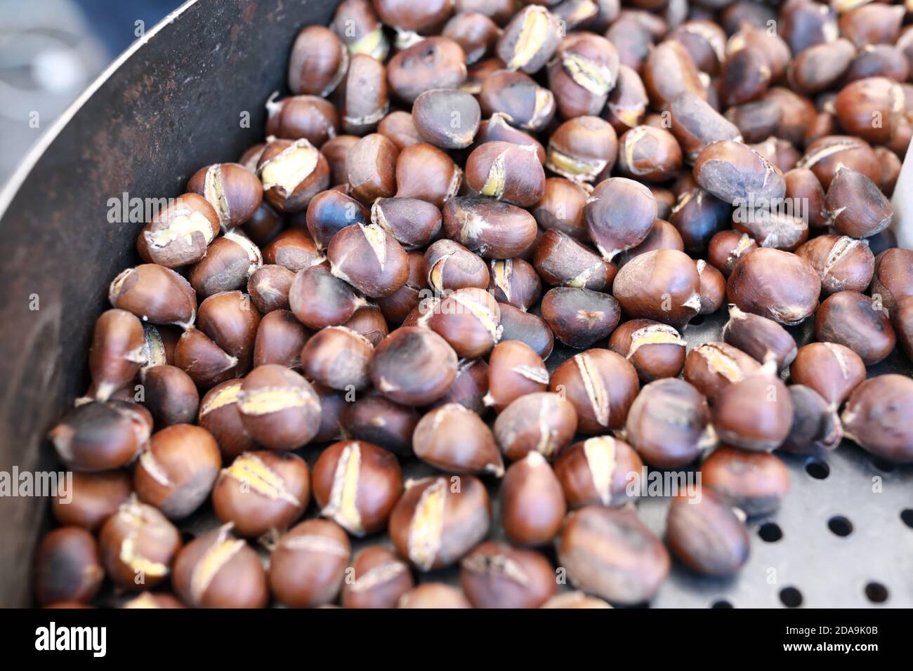 Roasting chestnuts in frying pan on street, Tbilisi Stock Photo Alamy