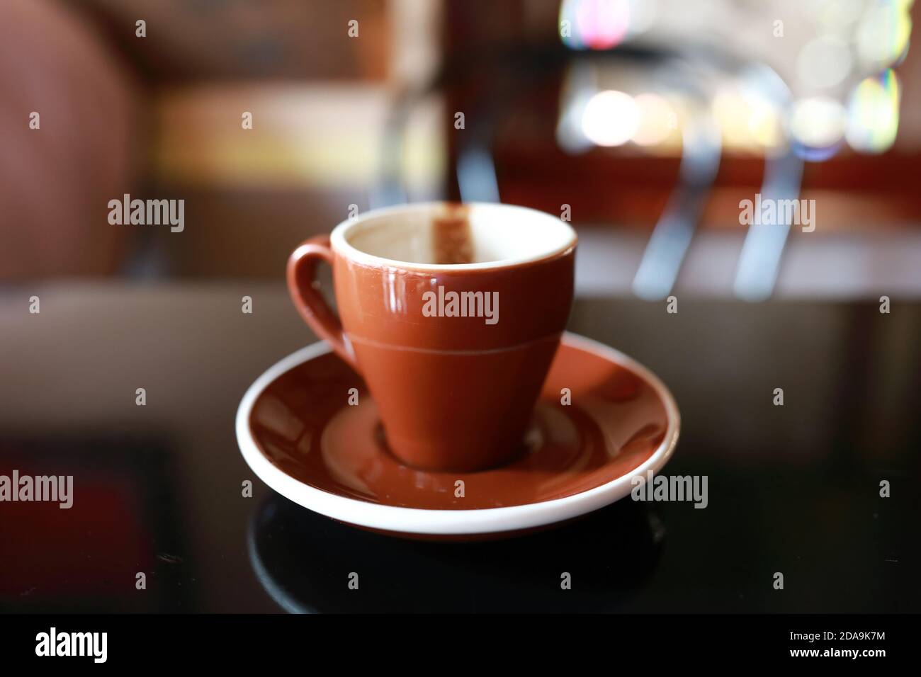 Empty cup of coffee on table in cafe Stock Photo
