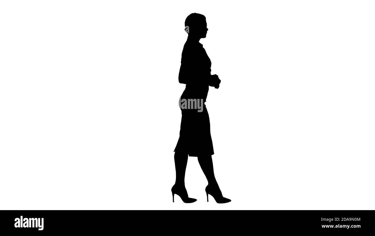 Silhouette Walking business woman Stock Photo - Alamy