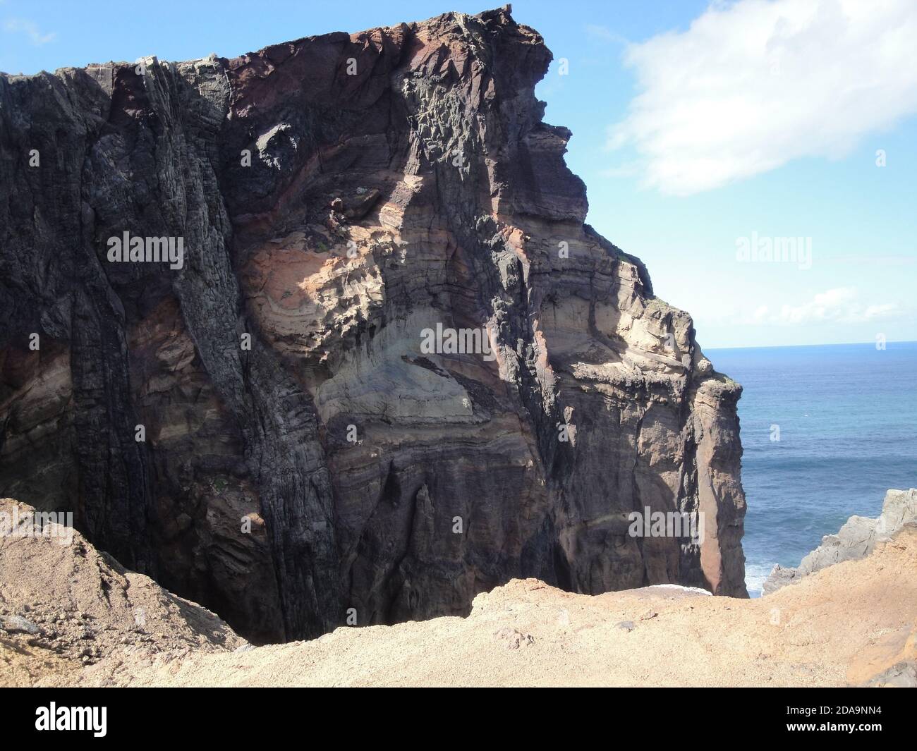 Eroded eruptive structures shaping a cliff on Madeira Stock Photo