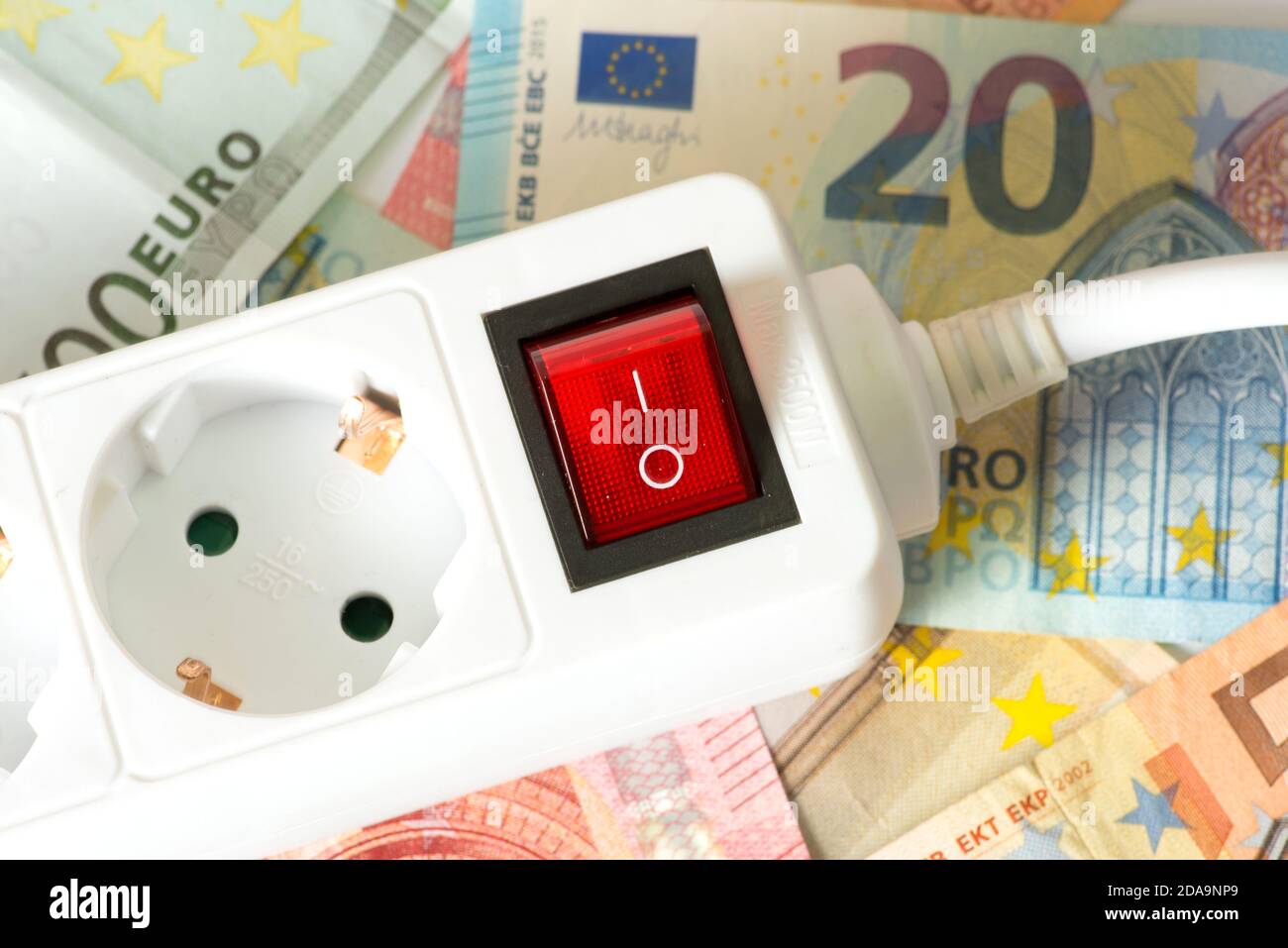 A power plug and euro bills Stock Photo