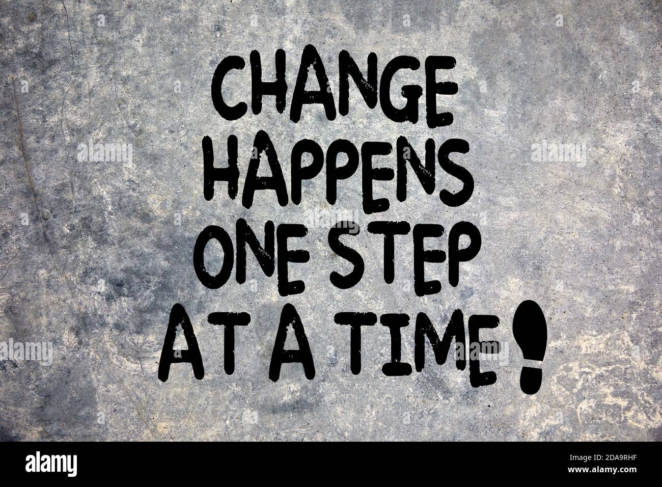 Change happens one step at at time quote written stone background in