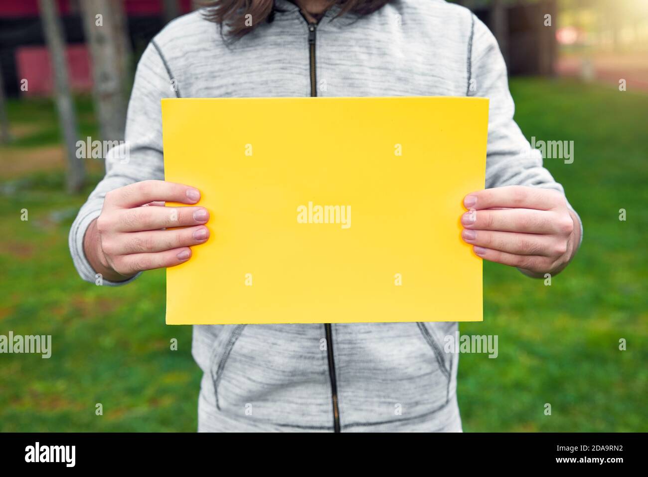 Teenage boy blank sign hi-res stock photography and images - Alamy