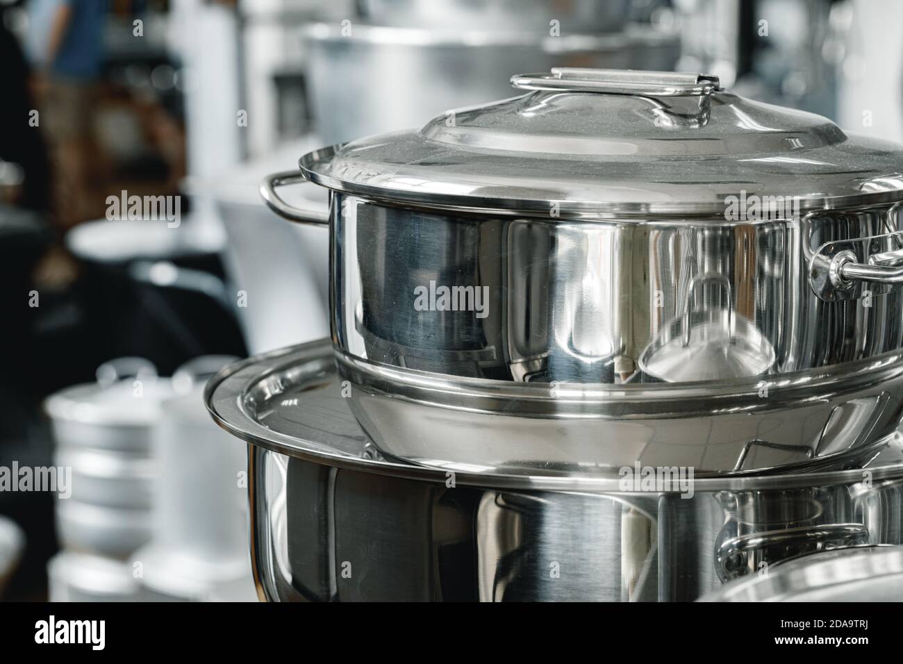 Stacked industrial metal cooking pots on proffesional kitchen Stock ...