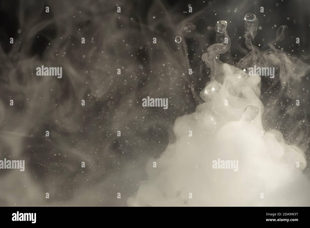 Water drop. Chemical reaction with boiling swirling water splashes